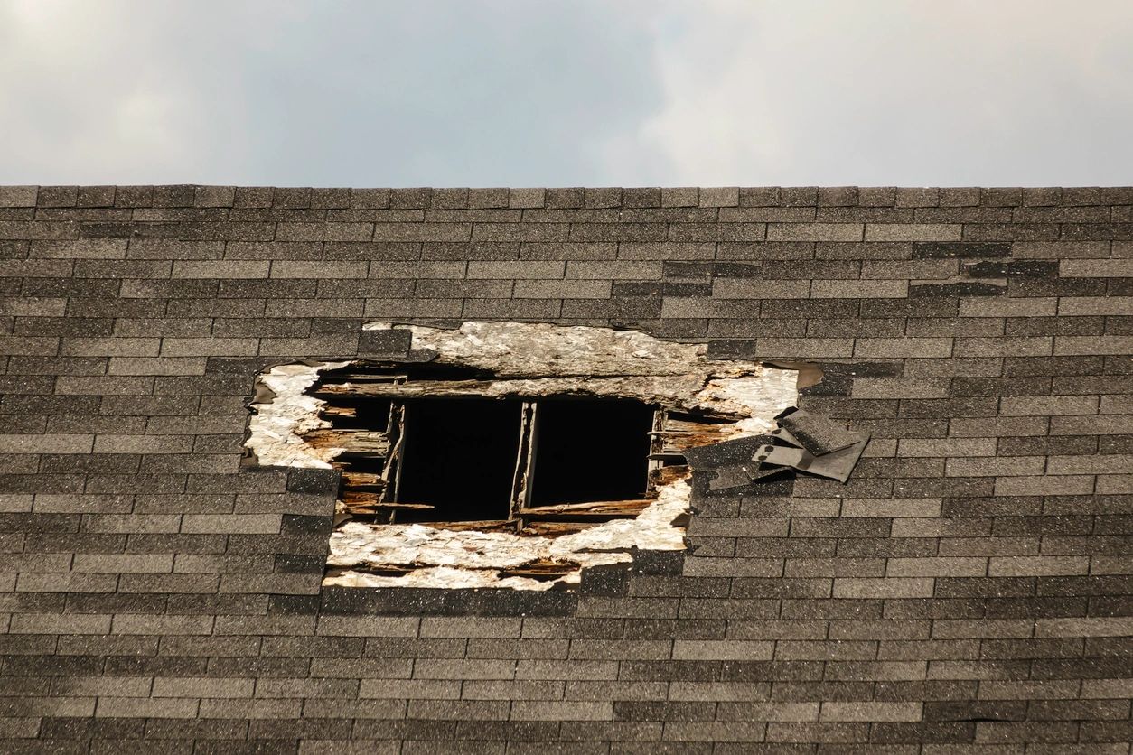 A hole in the roof of a building that has been torn down.